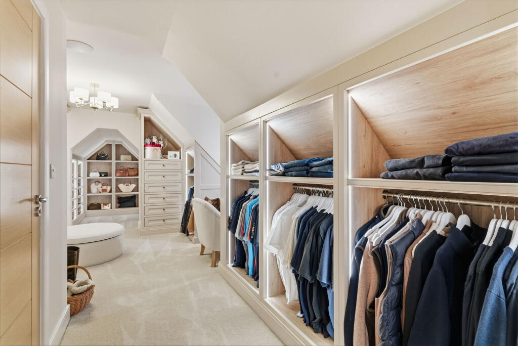 Long run of fitted dressing-room wardrobes and drawers