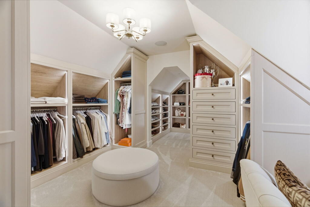 Walk-in dressing room fitted around a sloping ceiling
