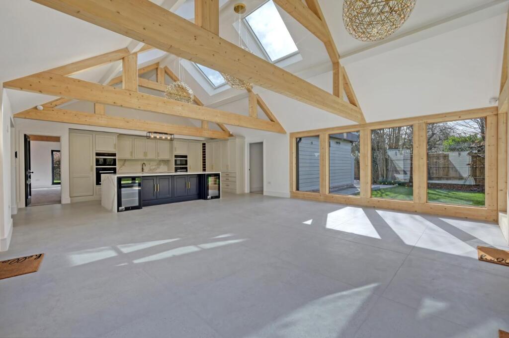 Wide view of bespoke kitchen cabinetry and island